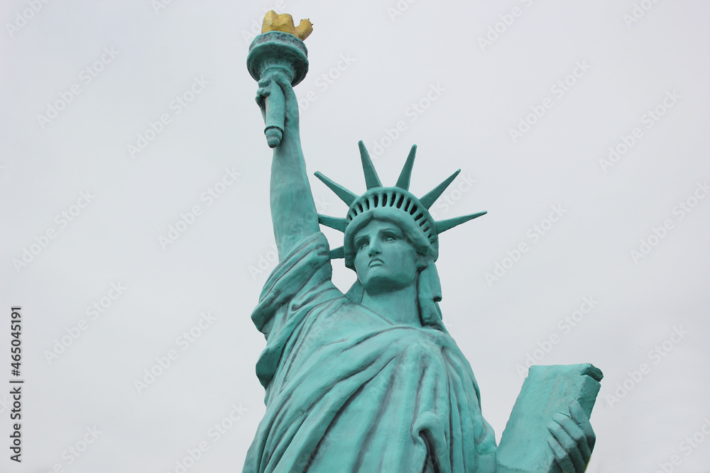 Fototapeta premium Statue of Liberty National Monument with blue sky background.