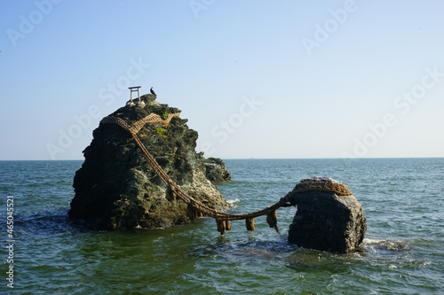 Meoto-iwa or rocks of the married couple at Futamiokitama-jinja (Shrine) in Mie, Japan - 三重県 二見興玉神社 夫婦岩 photo