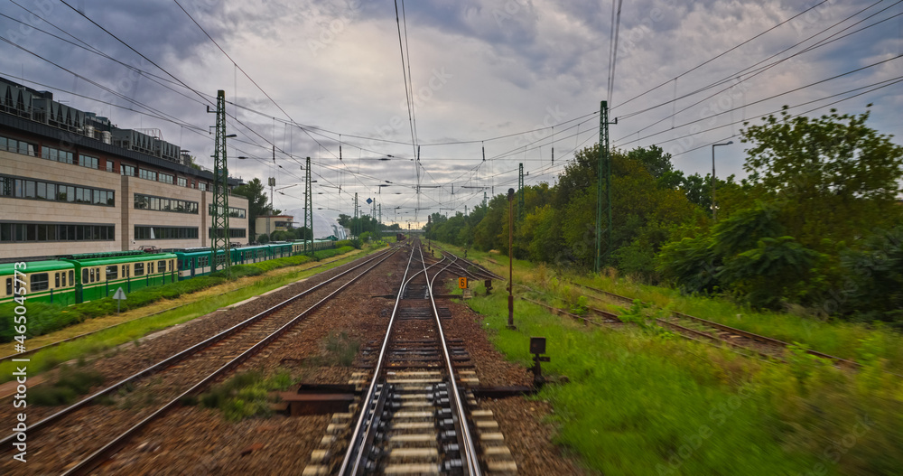 Point of view train travel under cloudy sky Point of view train travel under cloudy sky