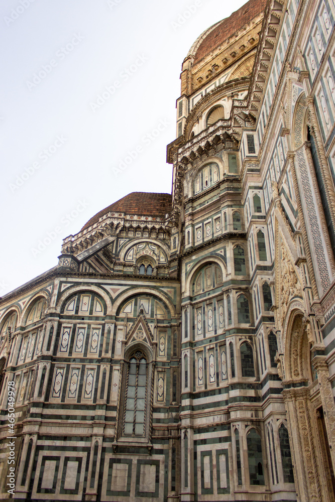 View on the side of the Duomo di Firenze also known as the Cathedral of Florence in beautiful golden hour light, Tuscany, Italy