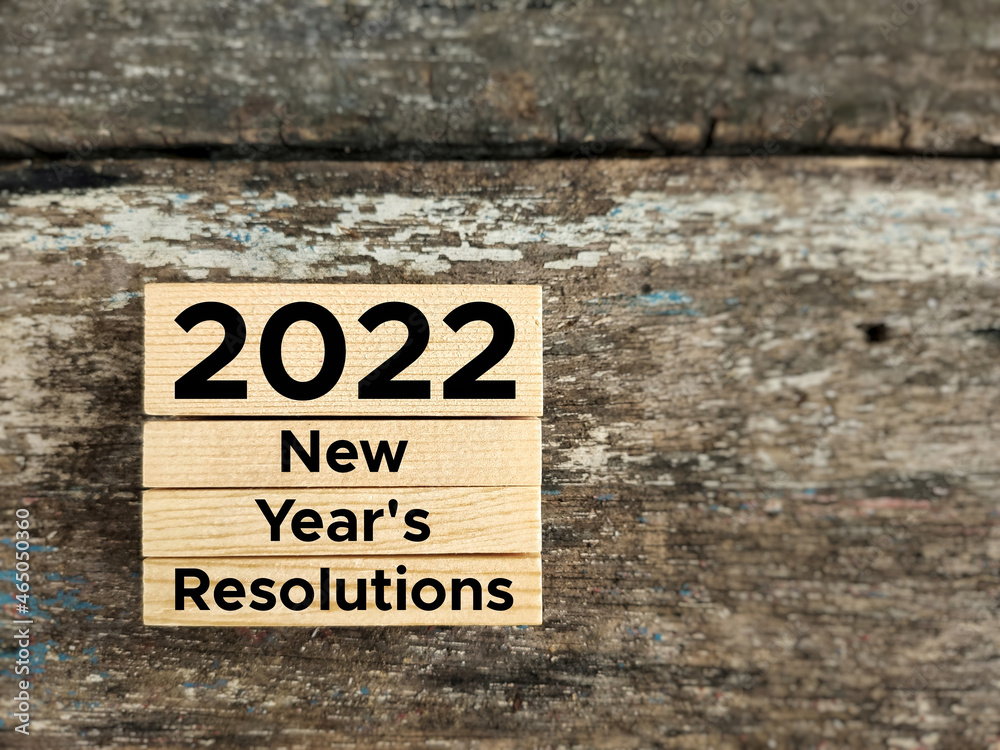 New Year Concept. 2022 NEW YEAR'S RESOLUTIONS text background. Stock photo. New Year Concept. 2022 NEW YEAR'S RESOLUTIONS text background. Stock photo.