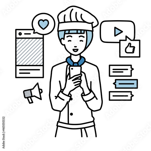 立ってスマートフォンでさまざまなSNSで楽しく交流する調理師の女性