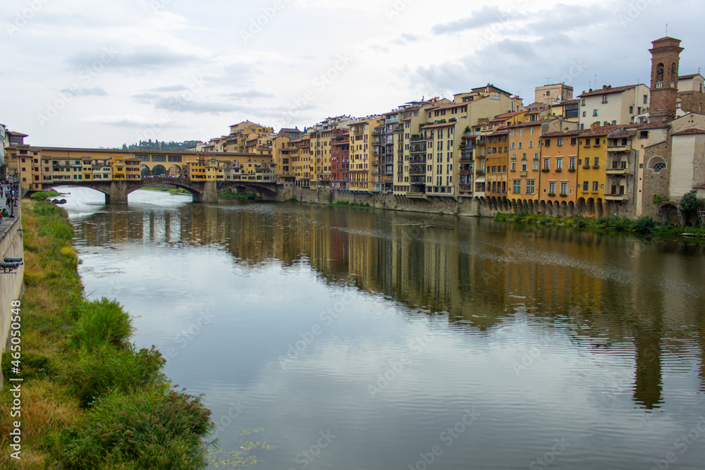 View of medieval stone bridge Ponte Vecchio and the Arno River from the Ponte Santa Trinita (Holy Trinity Bridge) natural look in Florence, Tuscany, Italy. 