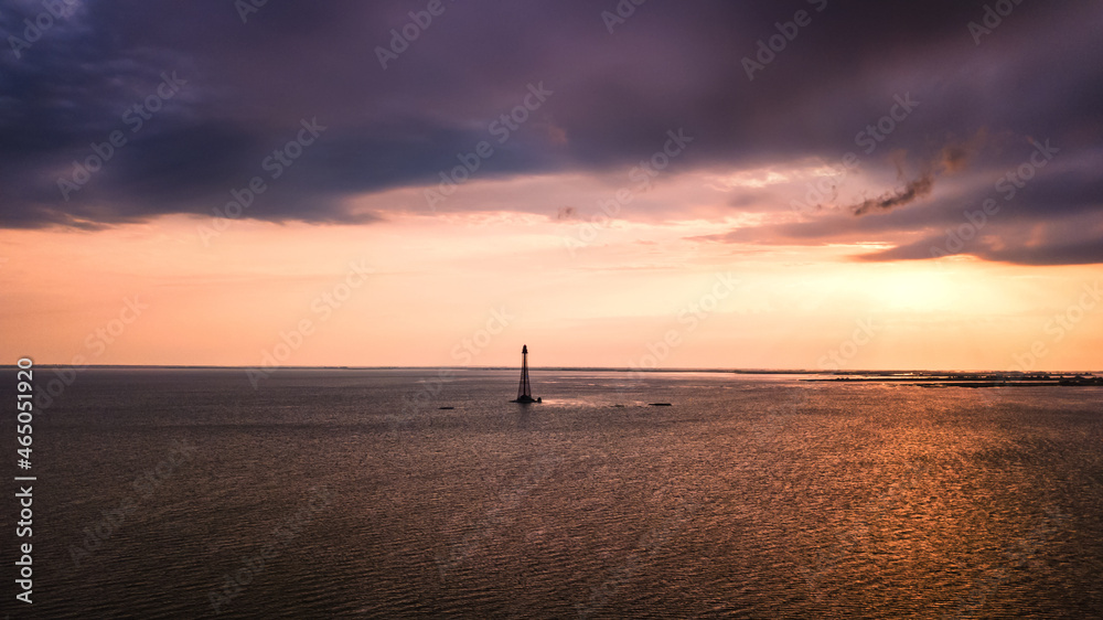 Beautiful seascape with lighthouse at sunset. aerial view, drone shot
