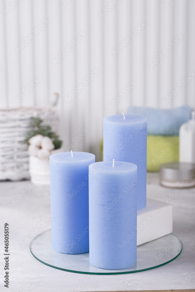 Blue candles in the bathroom. Terry towels and cotton pads. Blue candles in the bathroom. Terry towels and cotton pads.