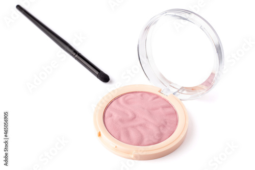 nude pink color eyeshadow in a palette with makeup brush isolated on white background. Highlighter and eyeshadows. Makeup product. Close up