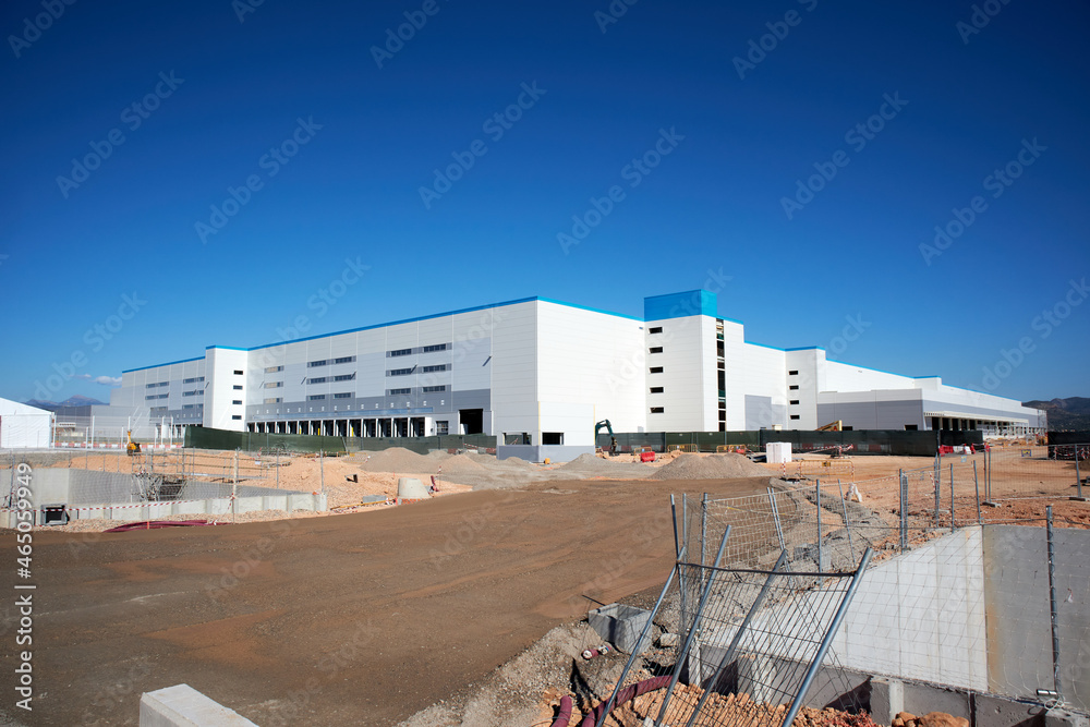 ONDA, SPAIN, OCTOBER - 2021: Amazon logistics center under construction of 200,000 square meters ONDA, SPAIN, OCTOBER - 2021: Amazon logistics center under construction of 200,000 square meters
