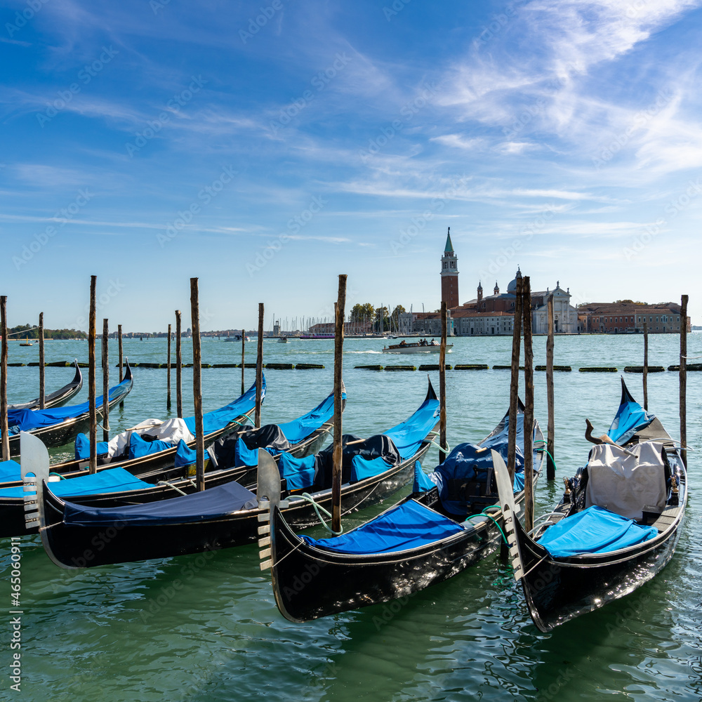 moored and tied up gondolas on the canals of Venice