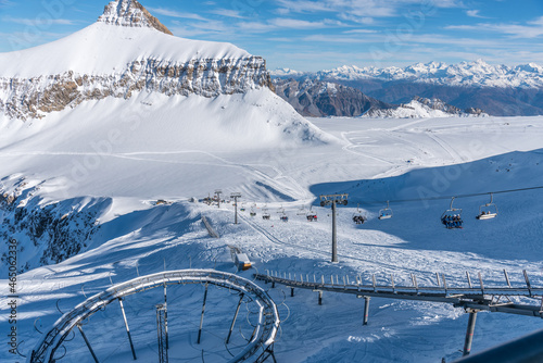 Chairlift and other rail transport in Diablerets glacier at 3000 meters above sea level on snowy mountain in winter day
