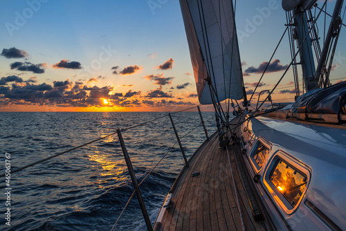 Fototapeta Naklejka Na Ścianę i Meble -  Sailboat sailing in the Mediterranean Sea at sunset