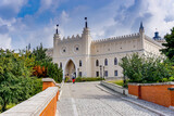 cobblestone street and bridge leading to the city gate and old town center of historic Lublin