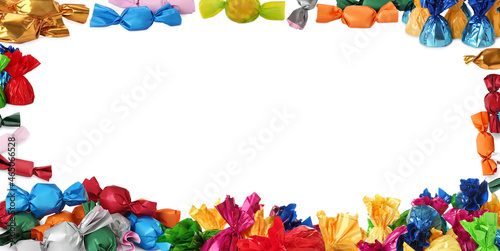 Frame made of tasty candies in colorful wrappers on white background. Banner design