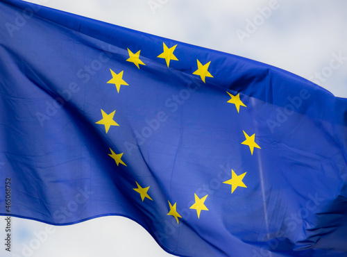 Official flag of the European Union in front of a blue sky