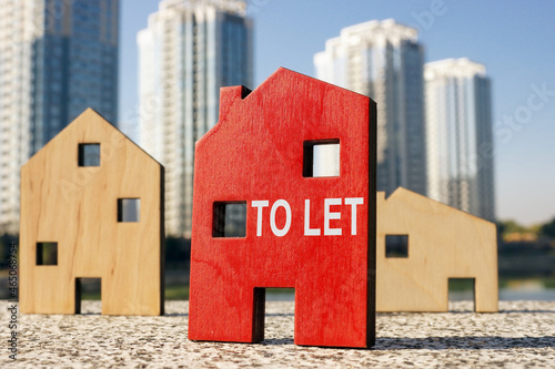 Buy to let concept. Small wooden houses. photo