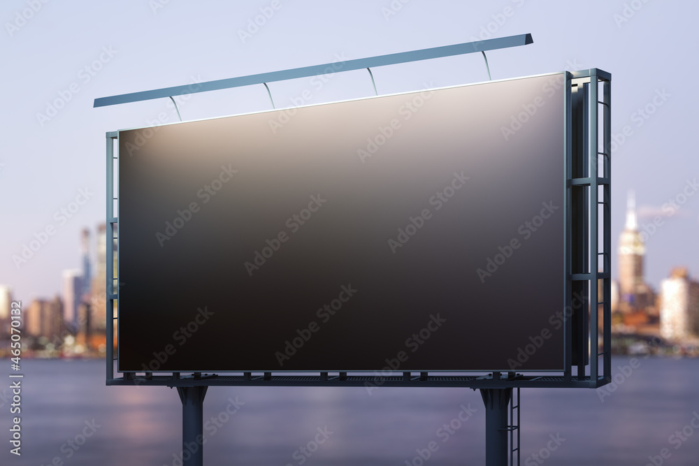 Blank black horizontal billboard on skyline background at evening, perspective view. Mock up, advertising concept Blank black horizontal billboard on skyline background at evening, perspective view. Mock up, advertising concept