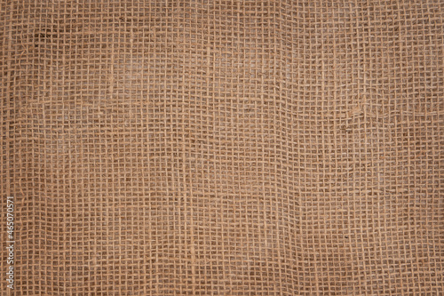 Background made of natural fabric burlap with square cells