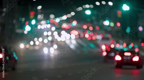 defocused background of generic night car traffic in city streets. photo