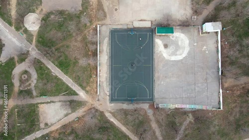 Top view of a basketball court during an outdoor game. Players on the court, on the court