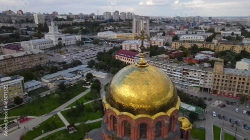 Aerial view of the beautiful Alexander Nevsky Cathedral Drone rotates over the old church with golden domes in the city center Beautiful temple