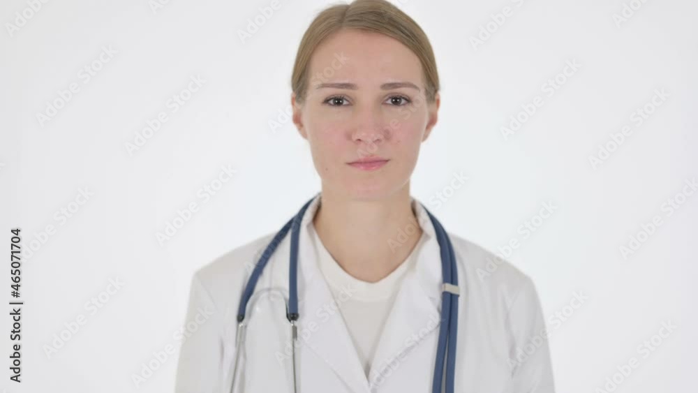 Female Doctor showing No Sign by Shaking Head on White Background Female Doctor showing No Sign by Shaking Head on White Background