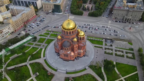 Aerial view of the beautiful Alexander Nevsky Cathedral Drone rotates over the old church with golden domes in the city center Beautiful temple