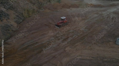 Air view. Demolition work is carried out with the help of an excavator. Heavy machinery.