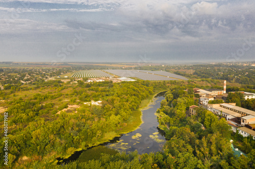 The tyasmin river on the background of the solar panels, view from a drone photo