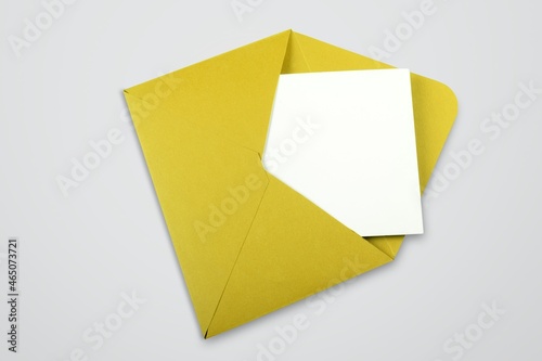 Photography Mockup or White Card in colored envelope on the desk