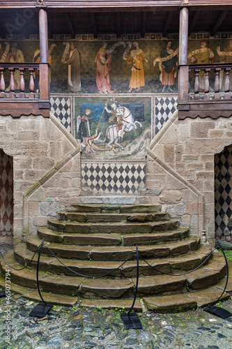 interior of the fenis castle with a beautiful  painting of San Giorgio killing the dragon photo
