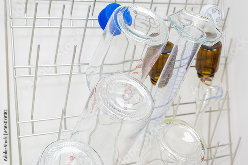 Chemical glassware are drying on the holder in chemical scientific laboratory.