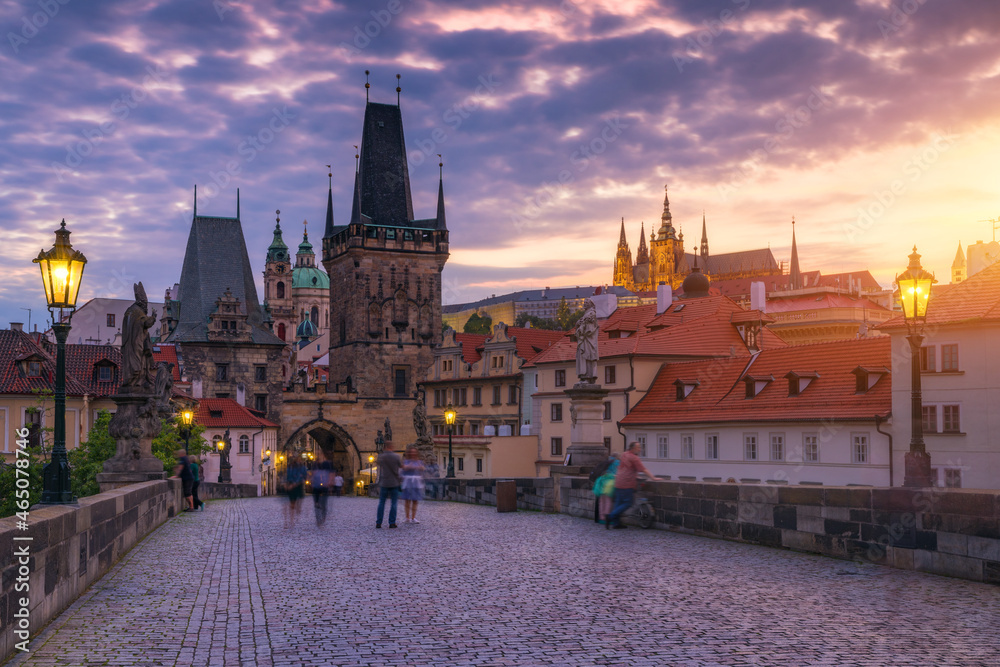 Charles Bridge in Prague in Czechia. Prague, Czech Republic. Charles Bridge (Karluv Most) and Old Town Tower. Vltava River and Charles Bridge. Concept of world travel, sightseeing and tourism.