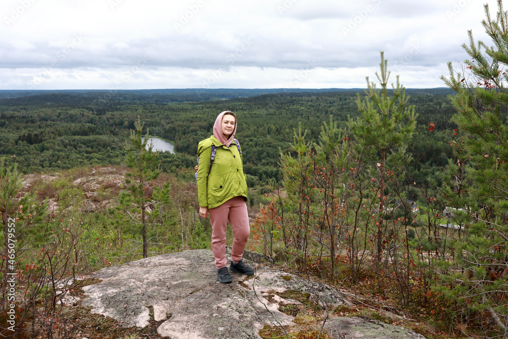 Fototapeta premium Woman posing on Mount Hiidenvuori