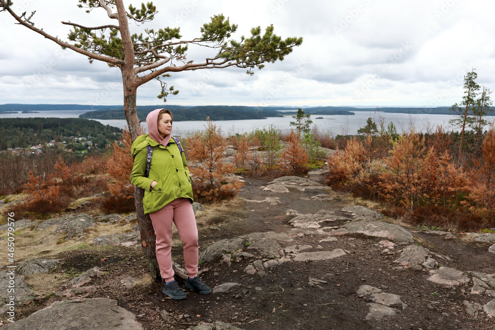 Fototapeta premium Woman standing on Mount Hiidenvuori