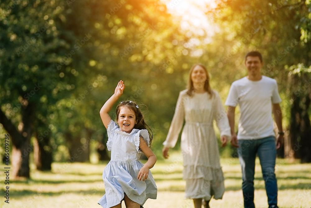 Happy family walking in the park Happy family walking in the park