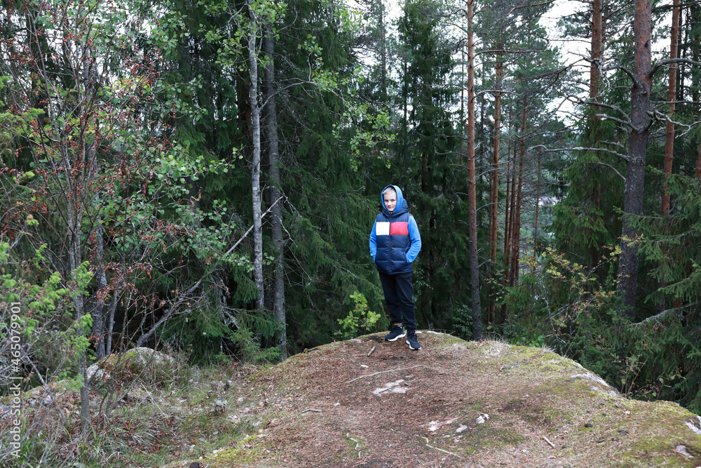 Kid at foot of Mount Hiidenvuori Kid at foot of Mount Hiidenvuori