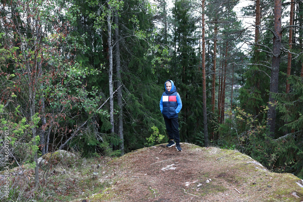 Kid at foot of Mount Hiidenvuori