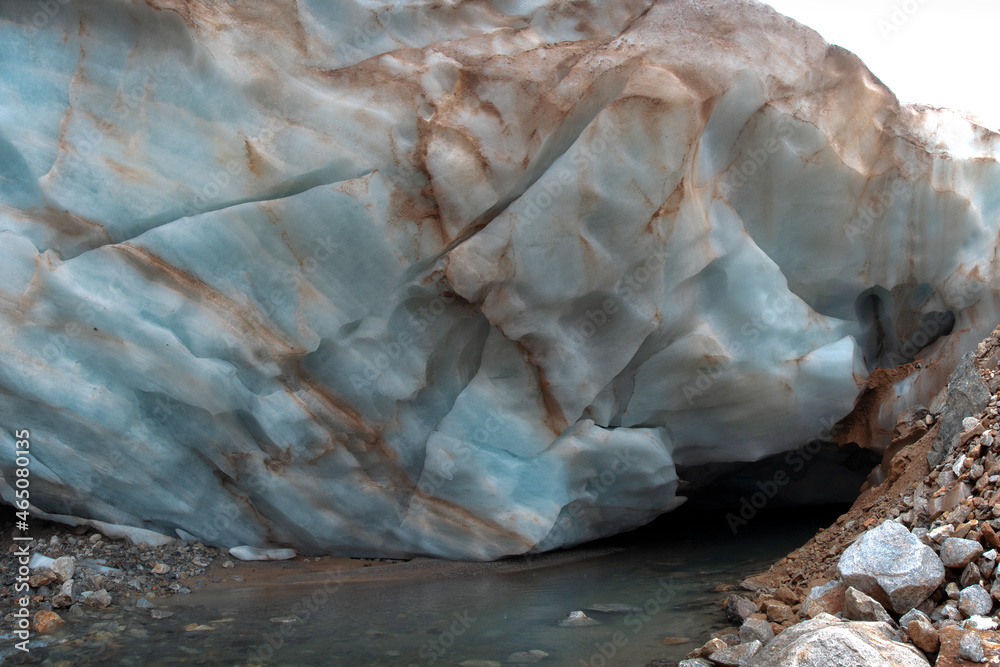 The ice wall of the Shaurtu mountain glacier in the Kabardino-Balkar Republic in the Caucasus
