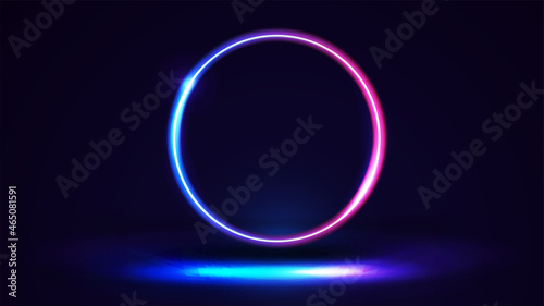 Dark scene with large pink and blue gradient neon ring.