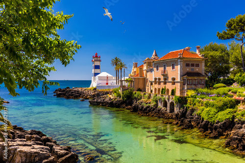 Santa Marta lighthouse and Municipal museum, Cascais, Lisbon, Portugal. Lighthouse Museum of Santa Marta in Cascais Portugal, as seen from Santa Marta Beach on a beautiful day. Cascais, Portugal.