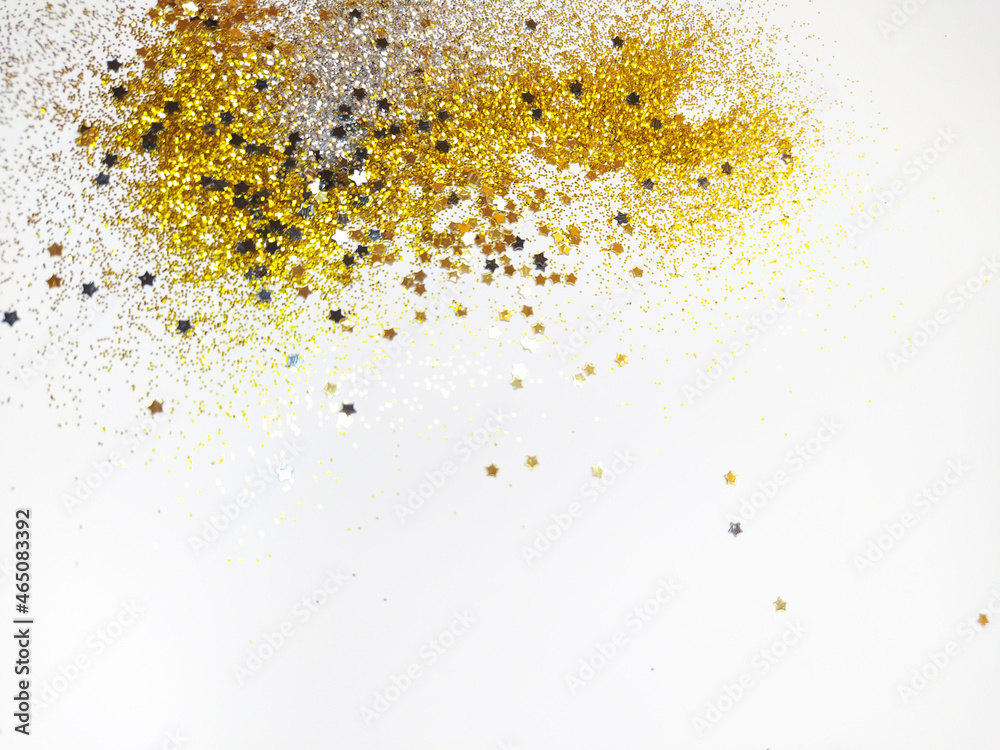 Christmas festive background with gold glitter, with place for text. The concept of a festive mood. The use of glitter in cosmetology and cooking