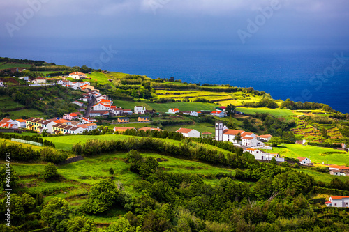 View of Pedreira village at northeast coast of Sao Miguel island, Azores, Portugal. View of Pedreira village and Pico do Bartolomeu at northeast coast of Sao Miguel island, Azores, Portugal. photo