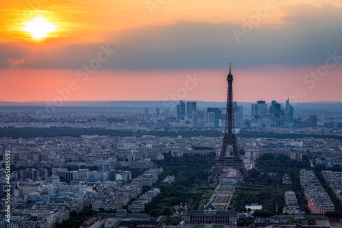 View of Paris with Eiffel Tower from Montparnasse building. Eiffel tower view from Montparnasse at sunset  view of the Eiffel Tower and La Defense district in Paris  France.