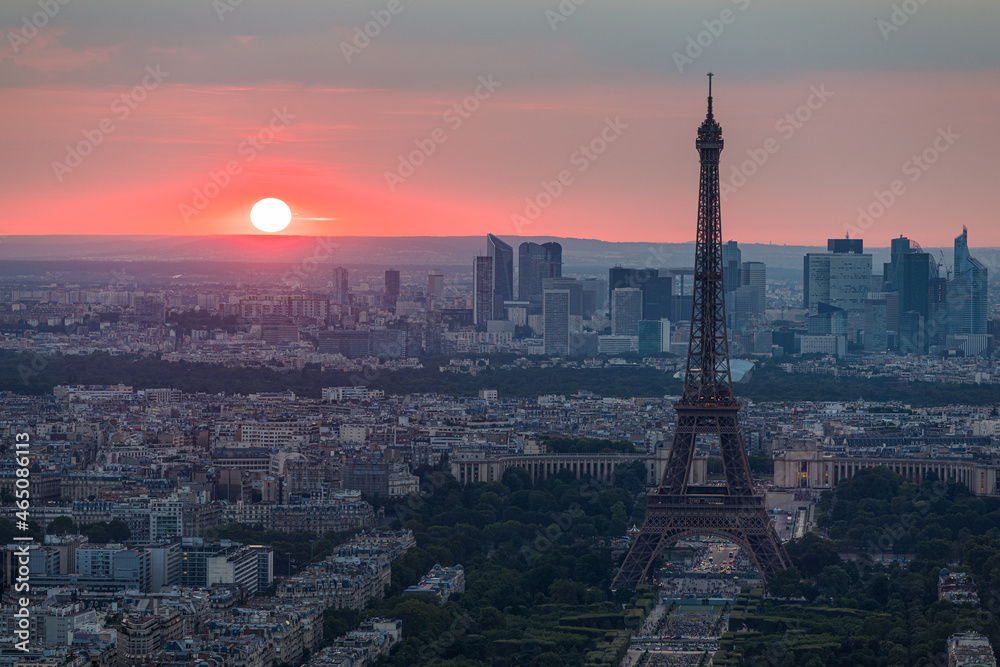 Panoramic aerial view of Paris, Eiffel Tower and La Defense business district. Aerial view of Paris at sunset. Panoramic view of Paris skyline with Eiffel Tower and La Defense. Paris, France.