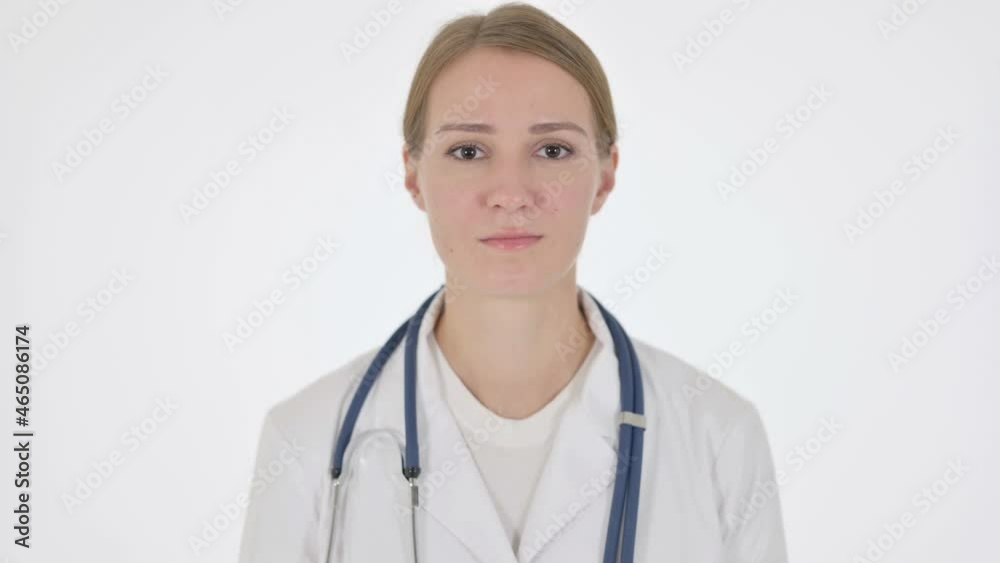 Serious Female Doctor Looking at the Camera on White Background Serious Female Doctor Looking at the Camera on White Background
