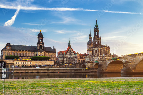 Augustus Bridge (Augustusbrucke) and Cathedral of the Holy Trinity (Hofkirche) over the River Elbe in Dresden, Germany, Saxony. photo