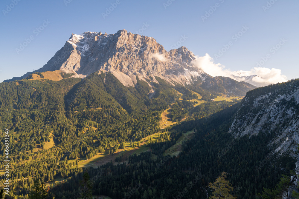 Panorama view of mountain Zugspitze at sunrise in the fall, near Ehrwald on the Path to Seebensee, Drachensee and Coburger Hütte