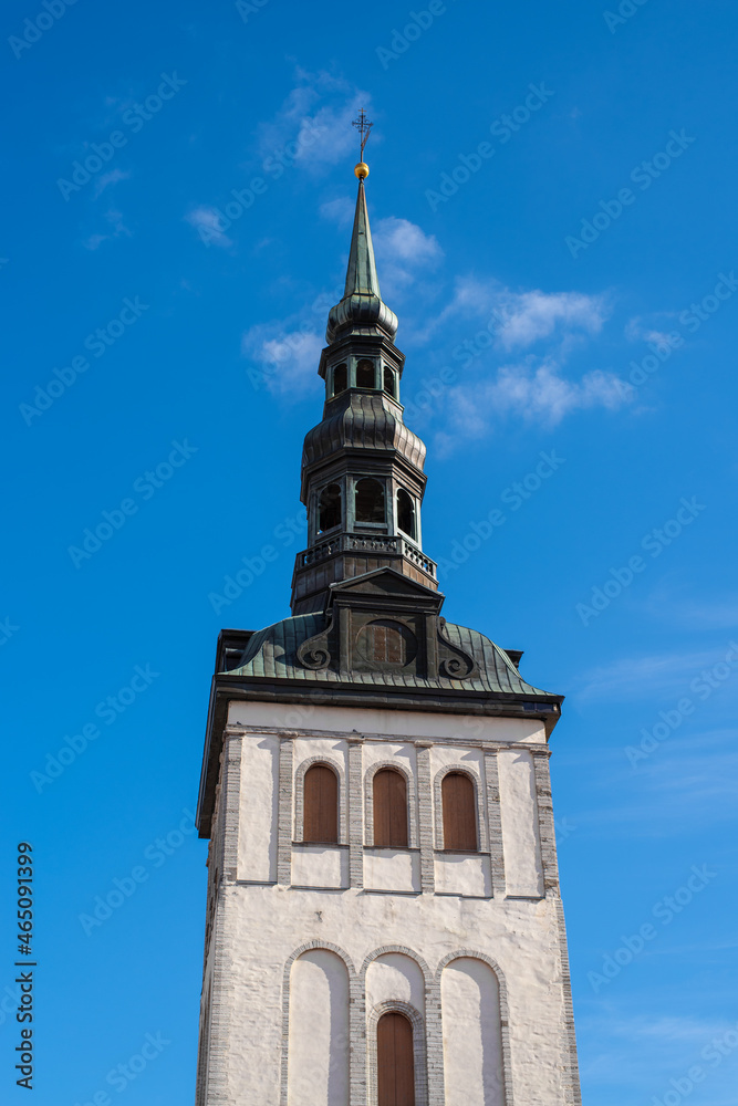 The steeple of St. Nicholas' Church (Niguliste) on a sunny autumn day. Tallinn, Estonia.