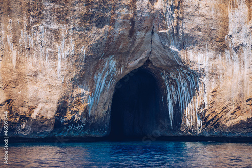 Blue sea and the characteristic caves of Cala Luna, a beach in the Golfo di Orosei, Sardinia, Italy. Big sea caves in the mediterranean coast. Sardinia, Italy. © daliu