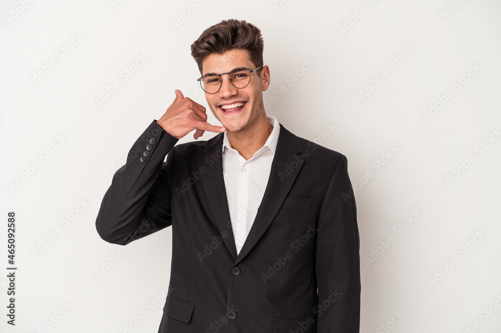 Young business caucasian man isolated on white background showing a mobile phone call gesture with fingers. Young business caucasian man isolated on white background showing a mobile phone call gesture with fingers.