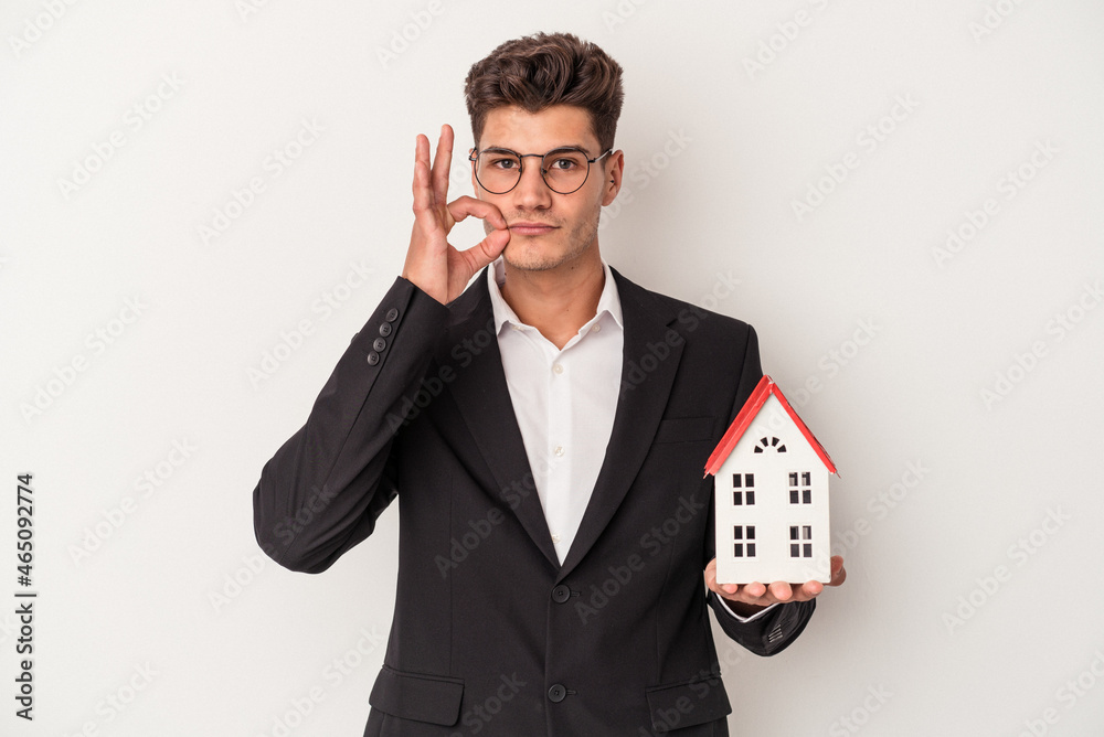 Young real estate caucasian agent isolated on white background with fingers on lips keeping a secret. Young real estate caucasian agent isolated on white background with fingers on lips keeping a secret.